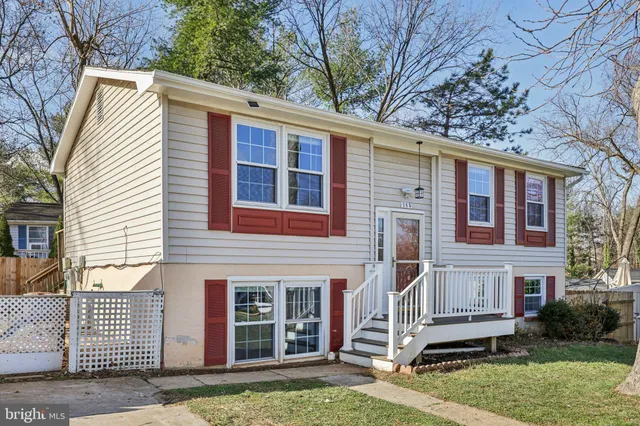 a view of a white house with a large windows