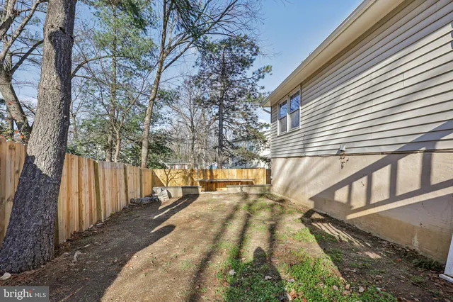 a view of house with staircase and outdoor seating