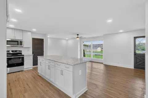 a view of small space with wooden floor and windows