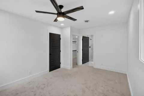 a bathroom with a shower and toilet
