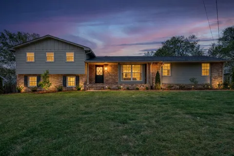 a view of a house with a big yard