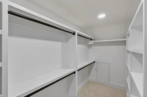 a view of a livingroom with a ceiling fan and window