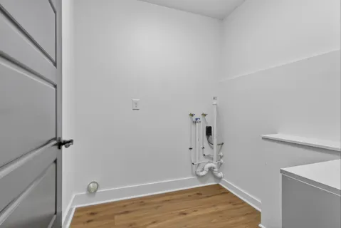 a bedroom with a bed a ceiling fan and a dresser