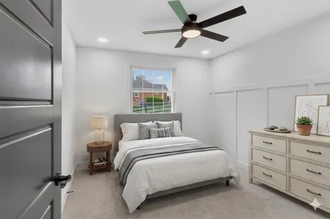 an empty room with closet and a ceiling fan