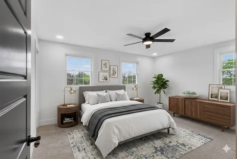 a view of a kitchen with a sink and a ceiling fan