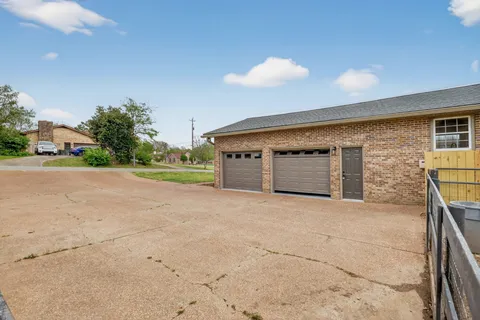 an aerial view of a house with a garden