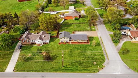 an aerial view of a house with a garden