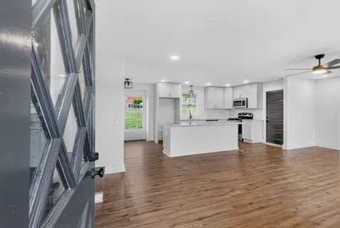 a kitchen with a refrigerator and window