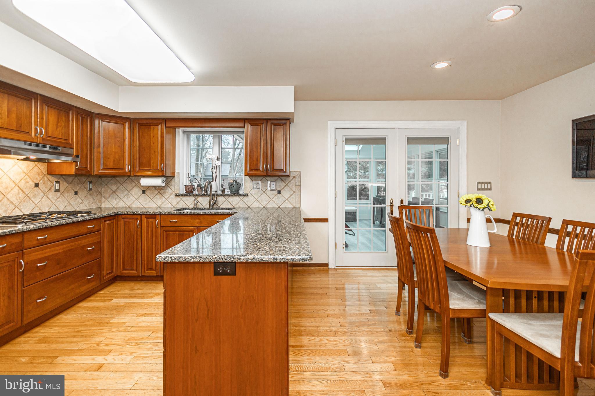 649 Teich Drive Yardley, PA 19067 - Photo 13 of 63 a kitchen with granite countertop lots of counter top space and dining table