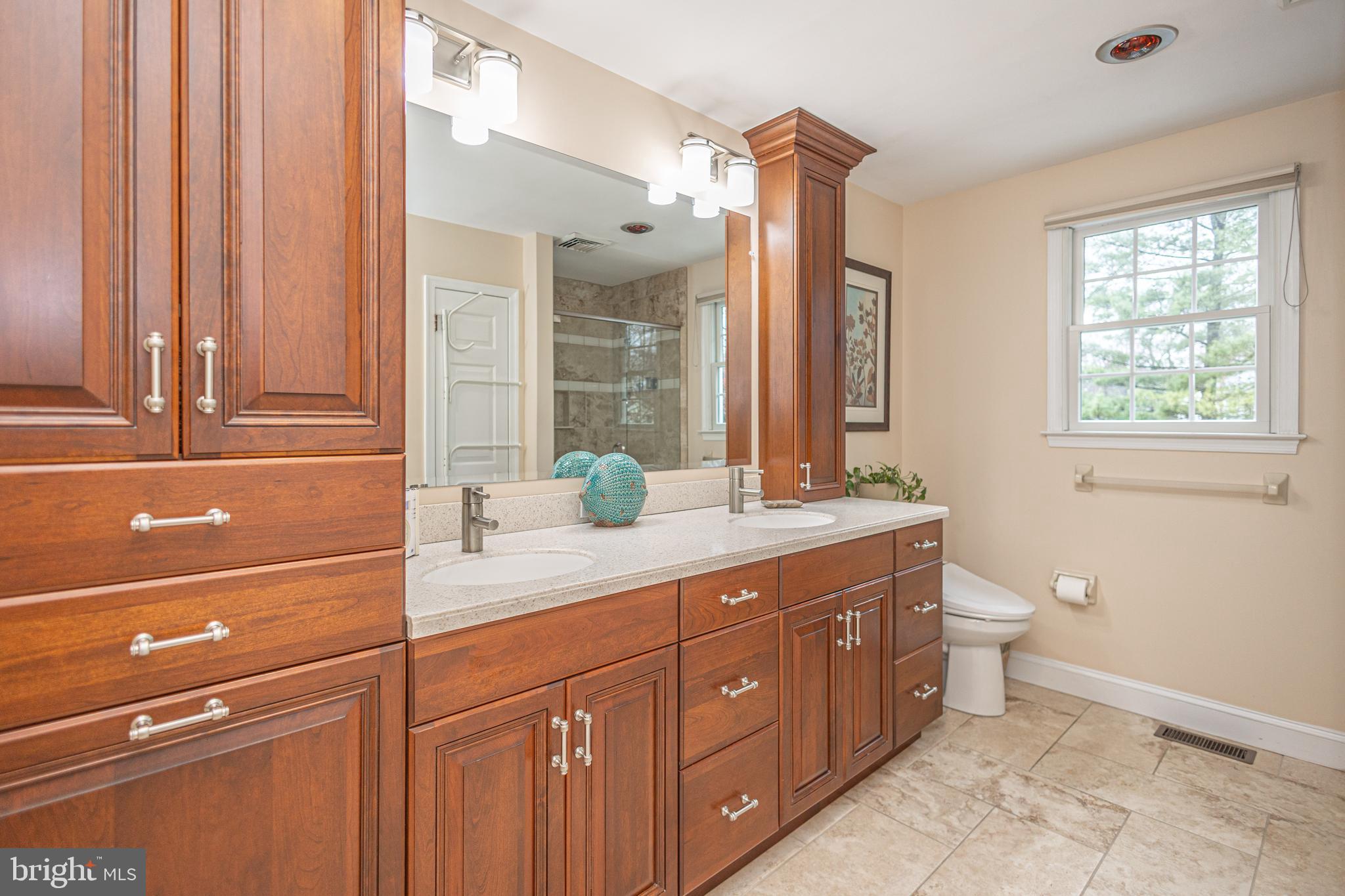 649 Teich Drive Yardley, PA 19067 - Photo 30 of 63 a spacious bathroom with a granite countertop sink a toilet and a mirror