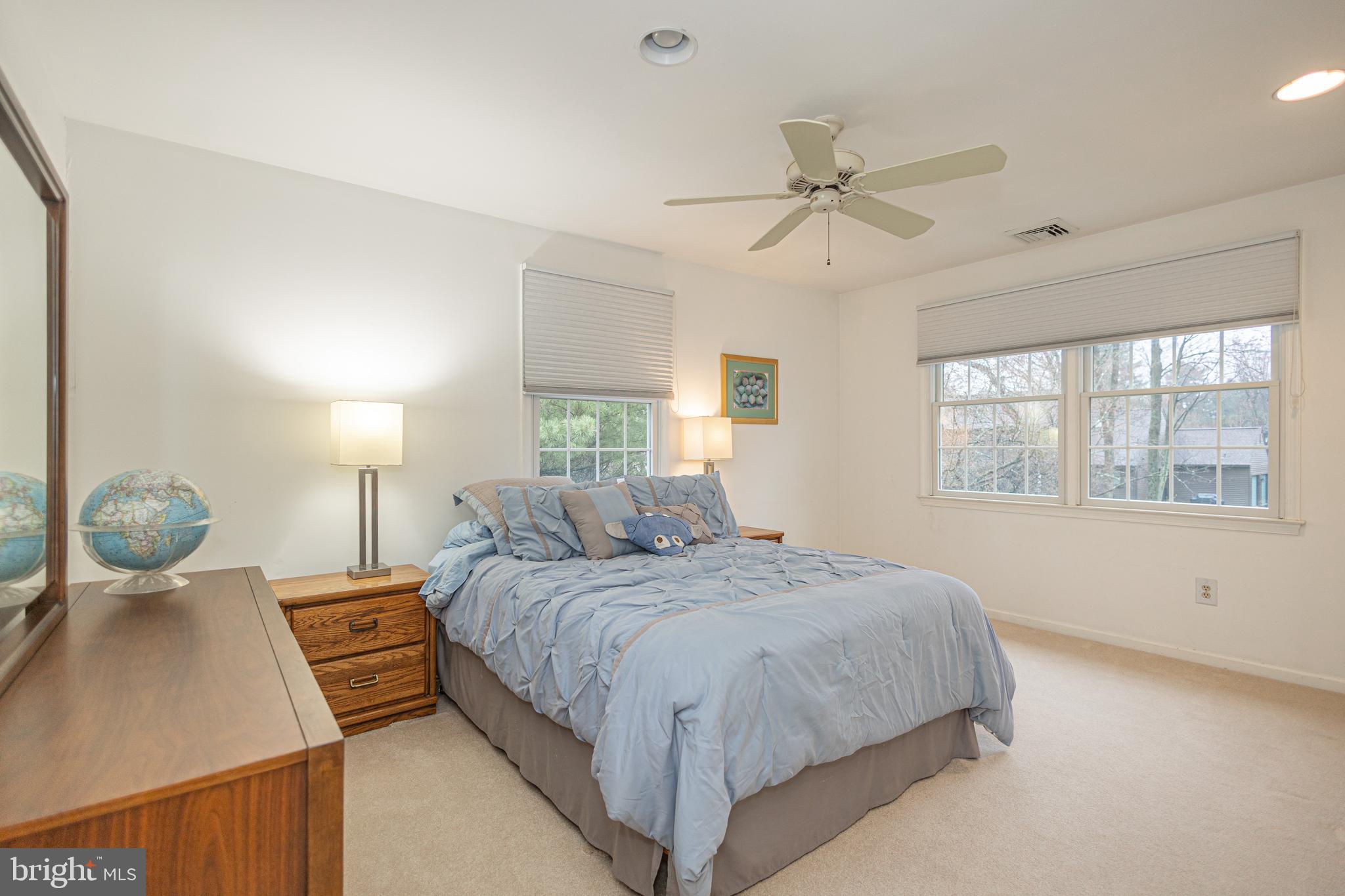 649 Teich Drive Yardley, PA 19067 - Photo 33 of 63 a bedroom with a large bed and windows