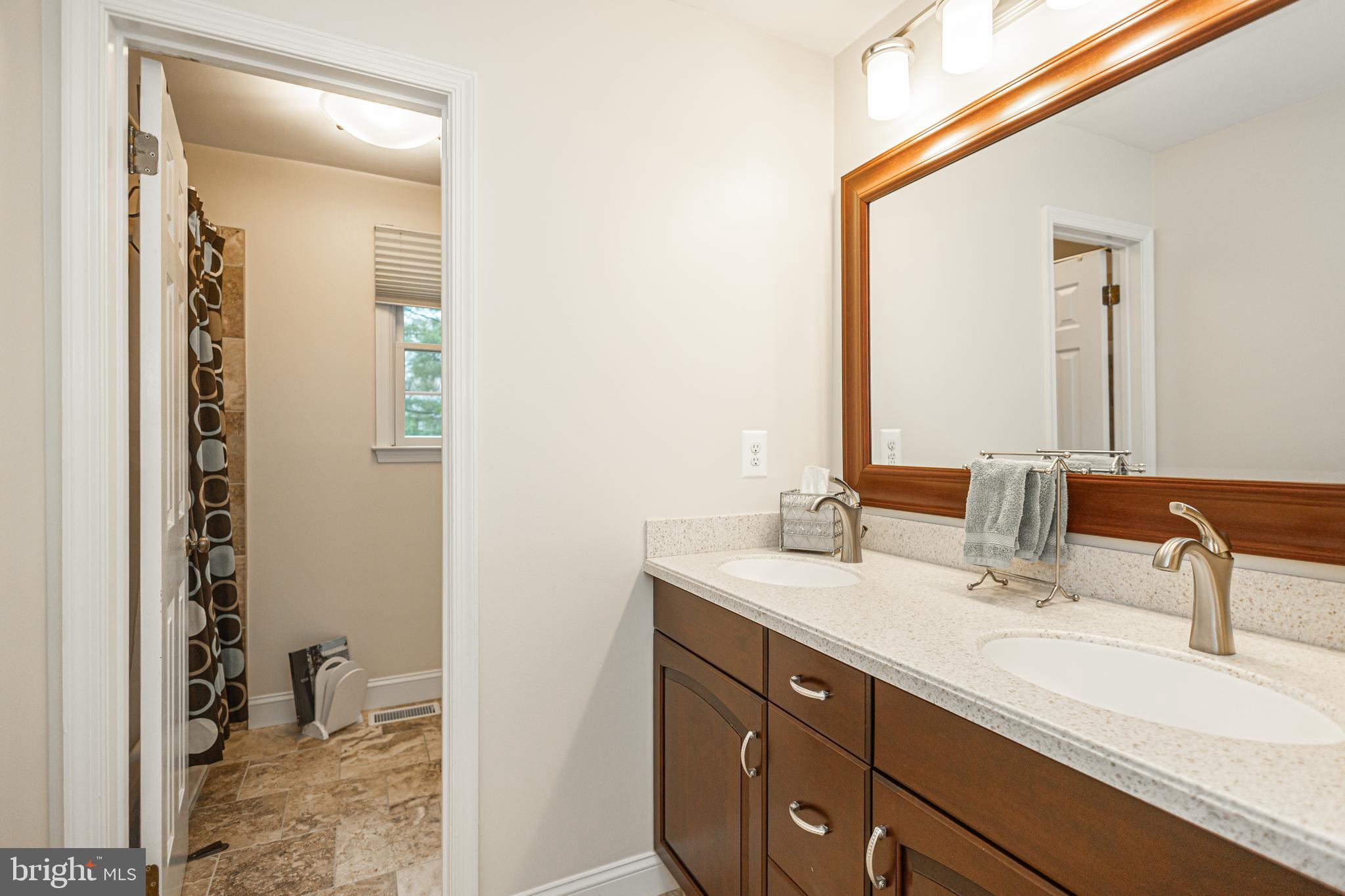 649 Teich Drive Yardley, PA 19067 - Photo 36 of 63 a bathroom with a sink and a mirror