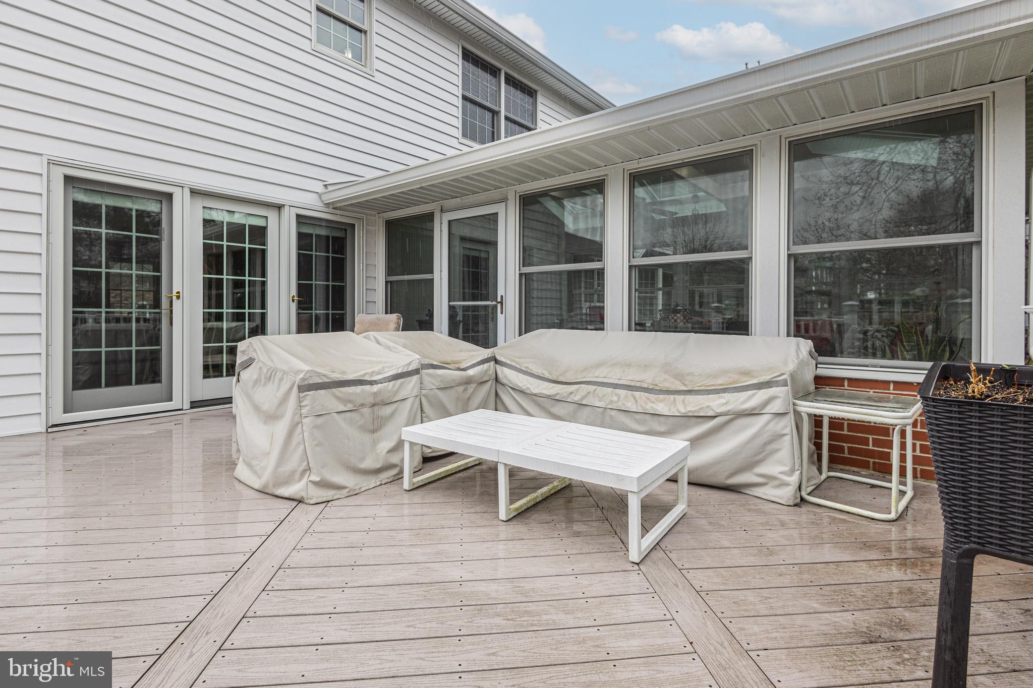649 Teich Drive Yardley, PA 19067 - Photo 49 of 63 a balcony with table and chairs and wooden floor