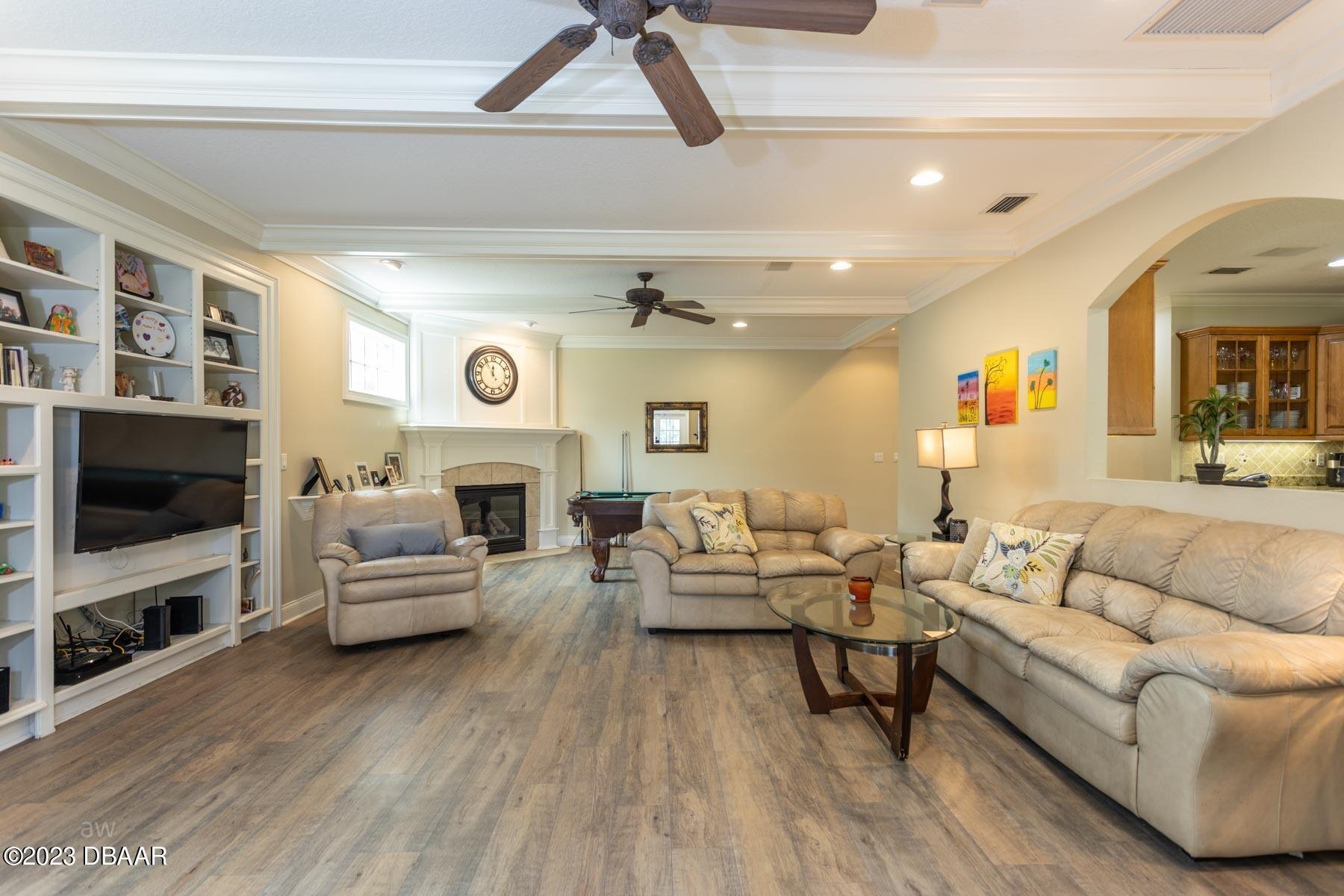 10 Foxhunter Flat Ormond Beach, FL 32174 - Photo 13 of 41 a living room with furniture and a flat screen tv