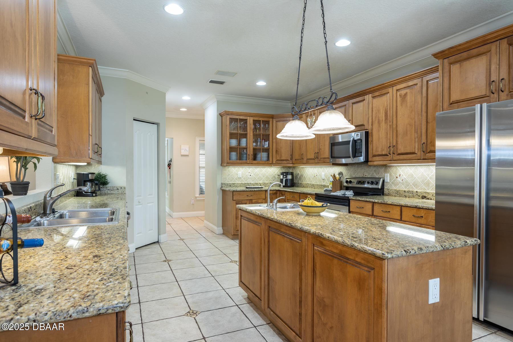 10 Foxhunter Flat Ormond Beach, FL 32174 - Photo 21 of 41 a kitchen with stainless steel appliances granite countertop a stove refrigerator sink and dishwasher
