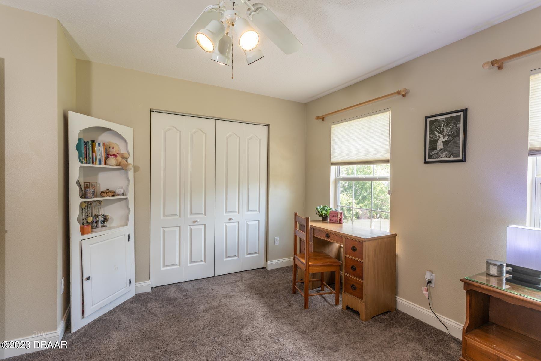 10 Foxhunter Flat Ormond Beach, FL 32174 - Photo 25 of 41 a view of a workspace with furniture and a window