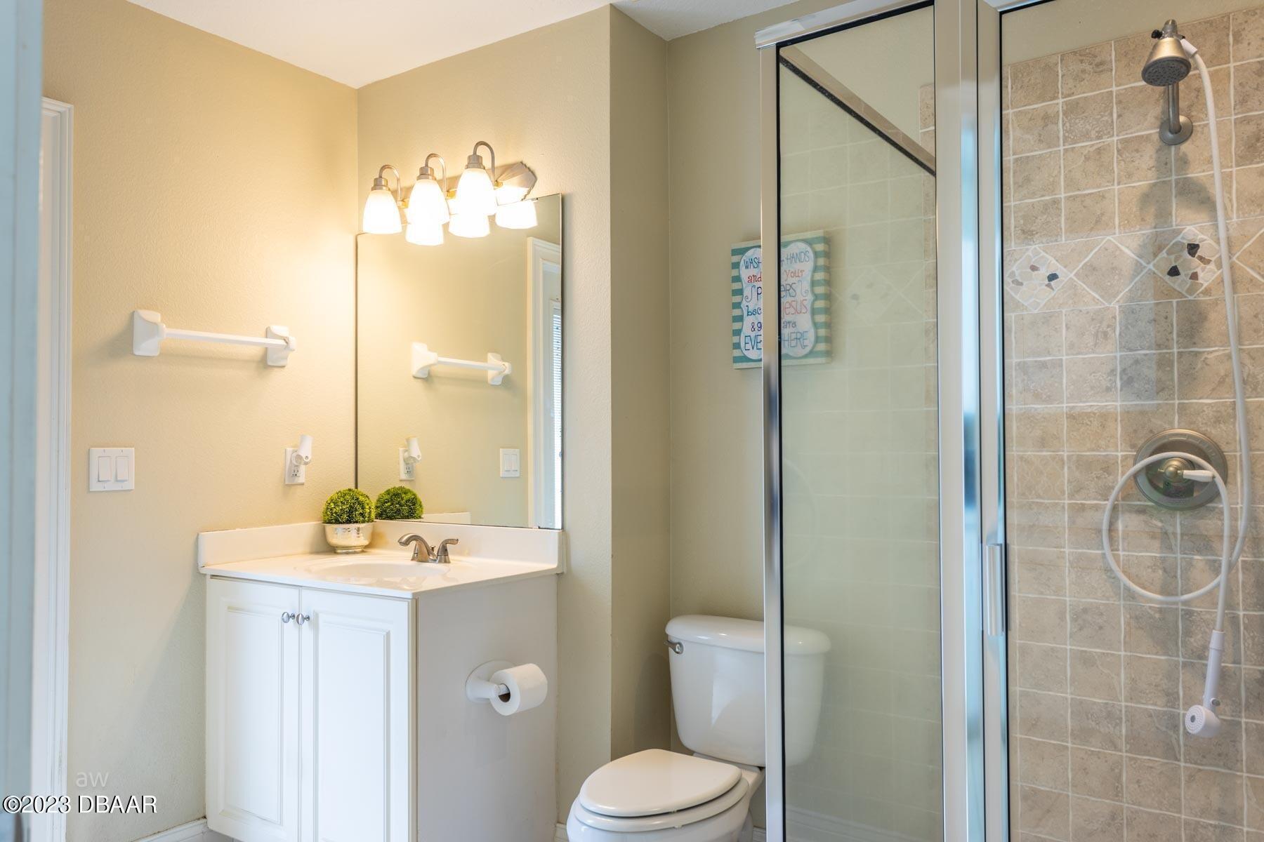 10 Foxhunter Flat Ormond Beach, FL 32174 - Photo 29 of 41 a bathroom with a sink mirror and toilet