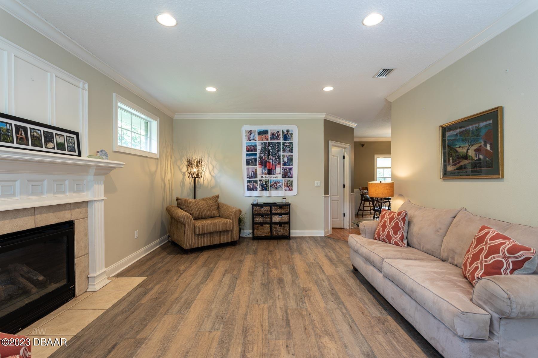10 Foxhunter Flat Ormond Beach, FL 32174 - Photo 3 of 41 a living room with furniture and a fireplace