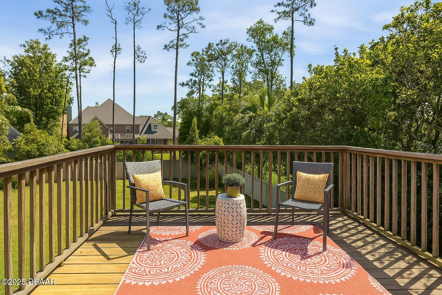 10 Foxhunter Flat Ormond Beach, FL 32174 - Photo 36 of 41 a view of a balcony with wooden floor and outdoor seating