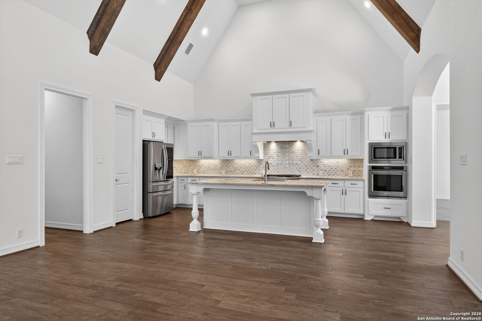 28640 Bull Gate Boerne, TX 78015 - Photo 12 of 40 a kitchen with stainless steel appliances a refrigerator and a stove top oven