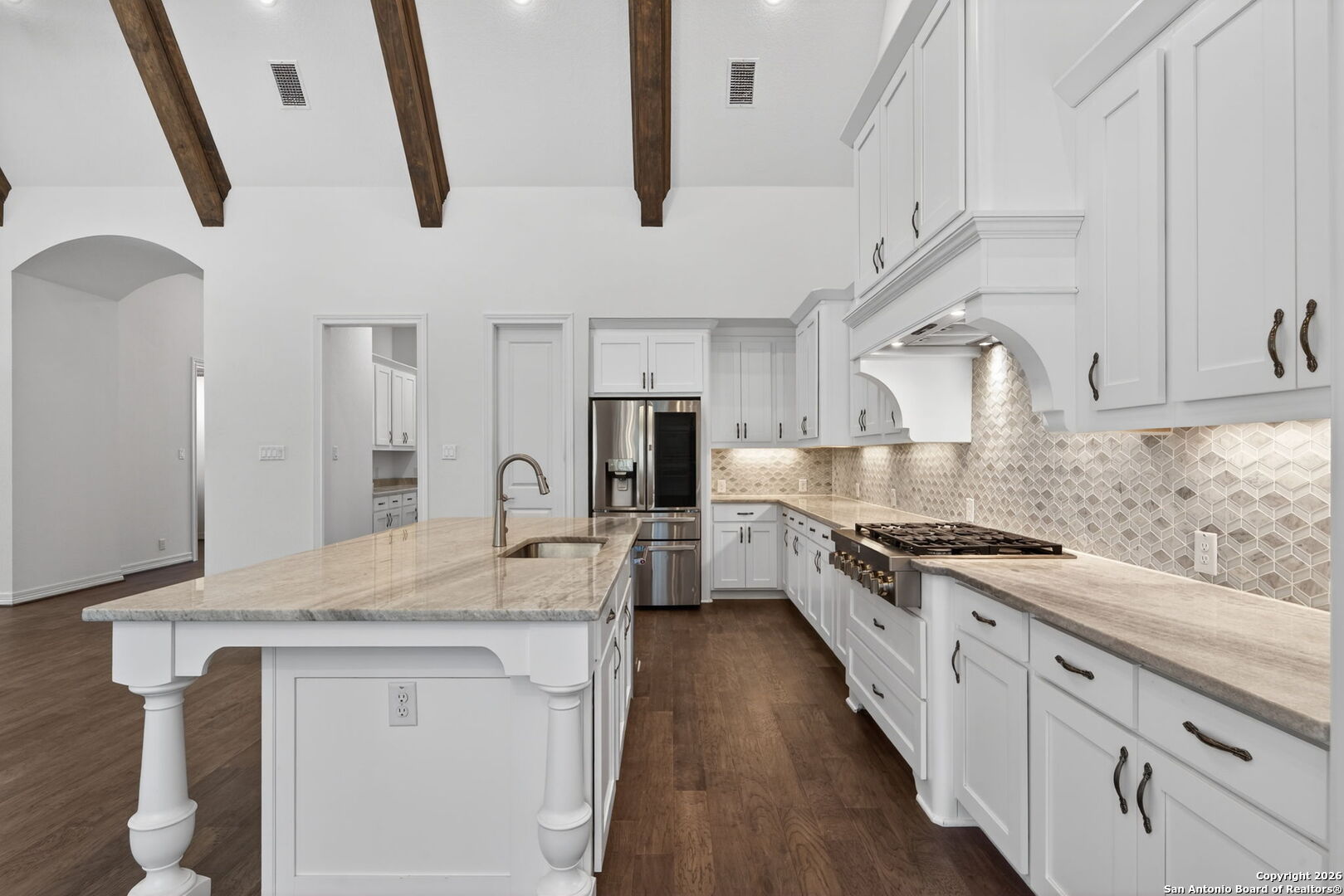 28640 Bull Gate Boerne, TX 78015 - Photo 14 of 40 a large kitchen with stainless steel appliances granite countertop a lot of counter space and wooden floor