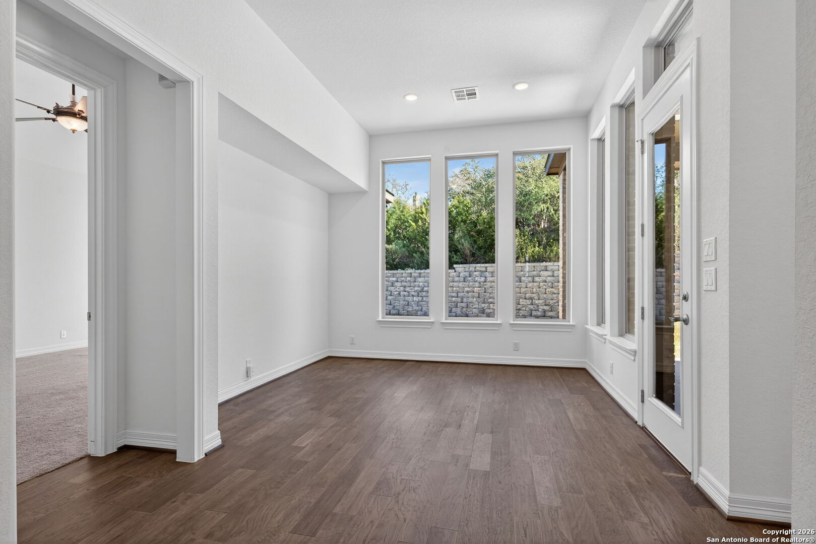 28640 Bull Gate Boerne, TX 78015 - Photo 15 of 40 a view of an empty room with wooden floor and a window