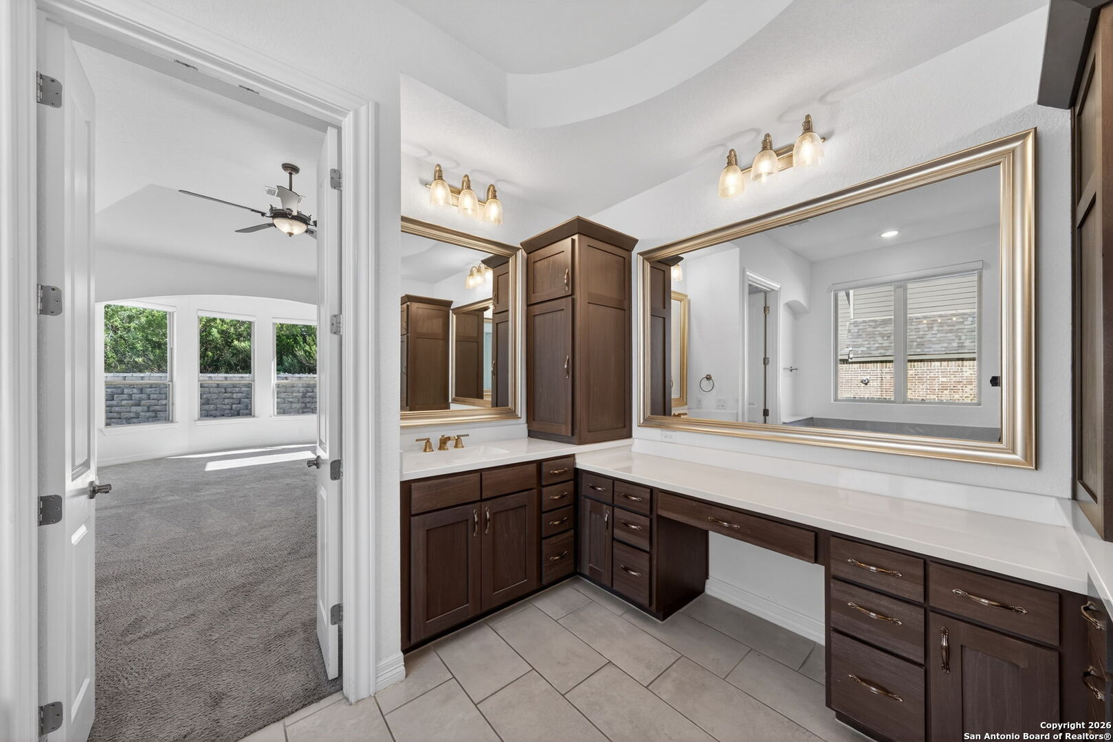 28640 Bull Gate Boerne, TX 78015 - Photo 25 of 40 a spacious bathroom with a double vanity sink a large mirror and a bathtub