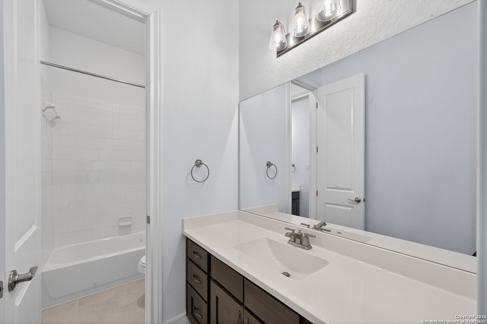 28640 Bull Gate Boerne, TX 78015 - Photo 31 of 40 a bathroom with a sink and a mirror