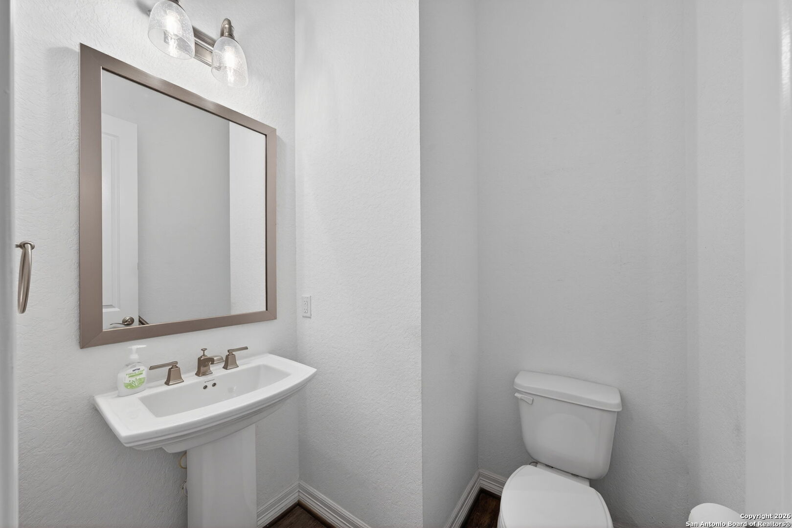 28640 Bull Gate Boerne, TX 78015 - Photo 36 of 40 a bathroom with a toilet sink and mirror