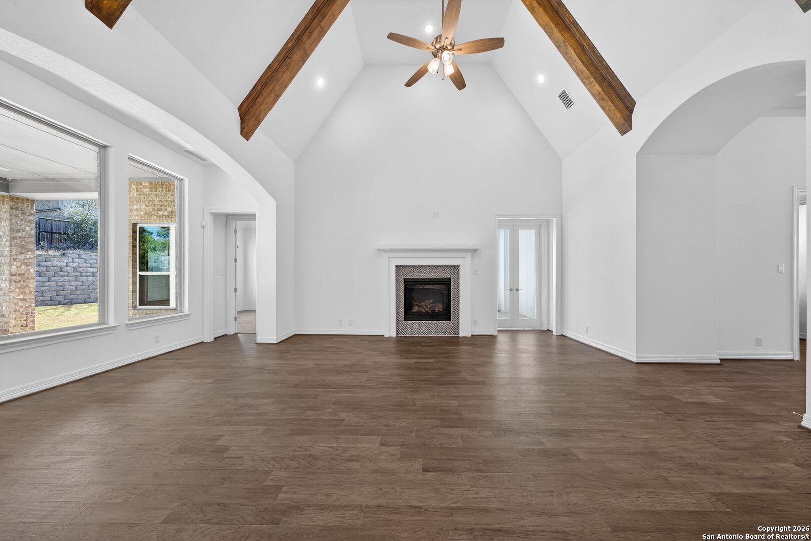28640 Bull Gate Boerne, TX 78015 - Photo 5 of 40 a view of an empty room with window and fireplace