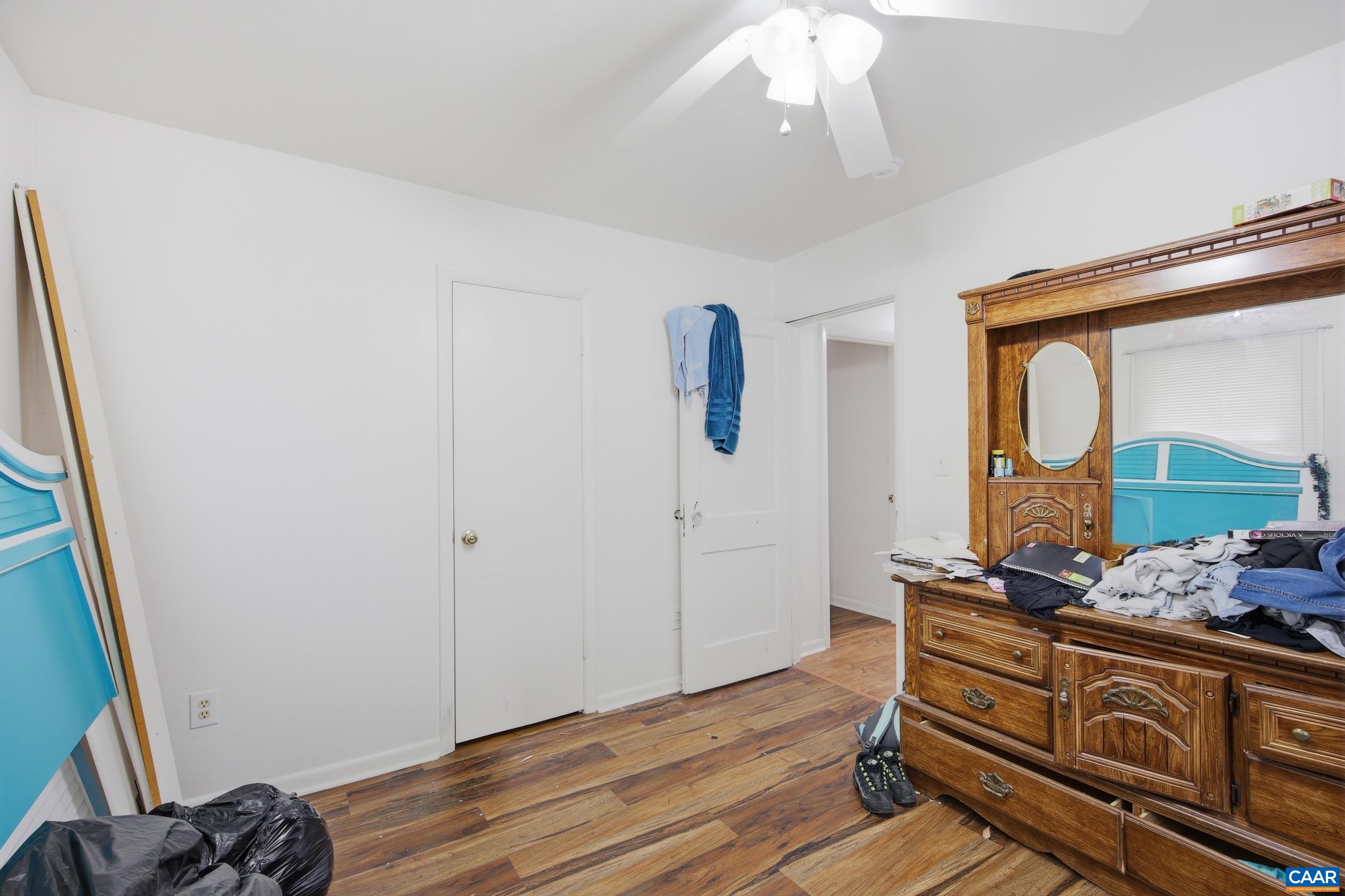 3590 Belle Meade Road Bumpass, VA 23024 - Photo 13 of 21 a room with wooden floor and furniture