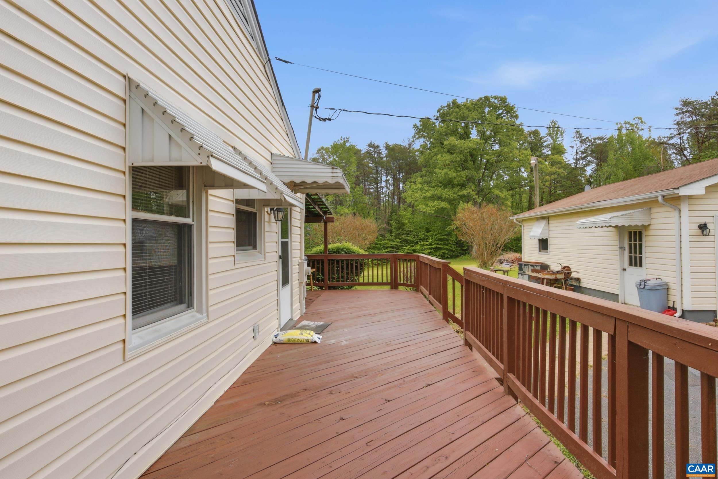 3590 Belle Meade Road Bumpass, VA 23024 - Photo 14 of 21 a view of a balcony with wooden floor and fence and a potted plant