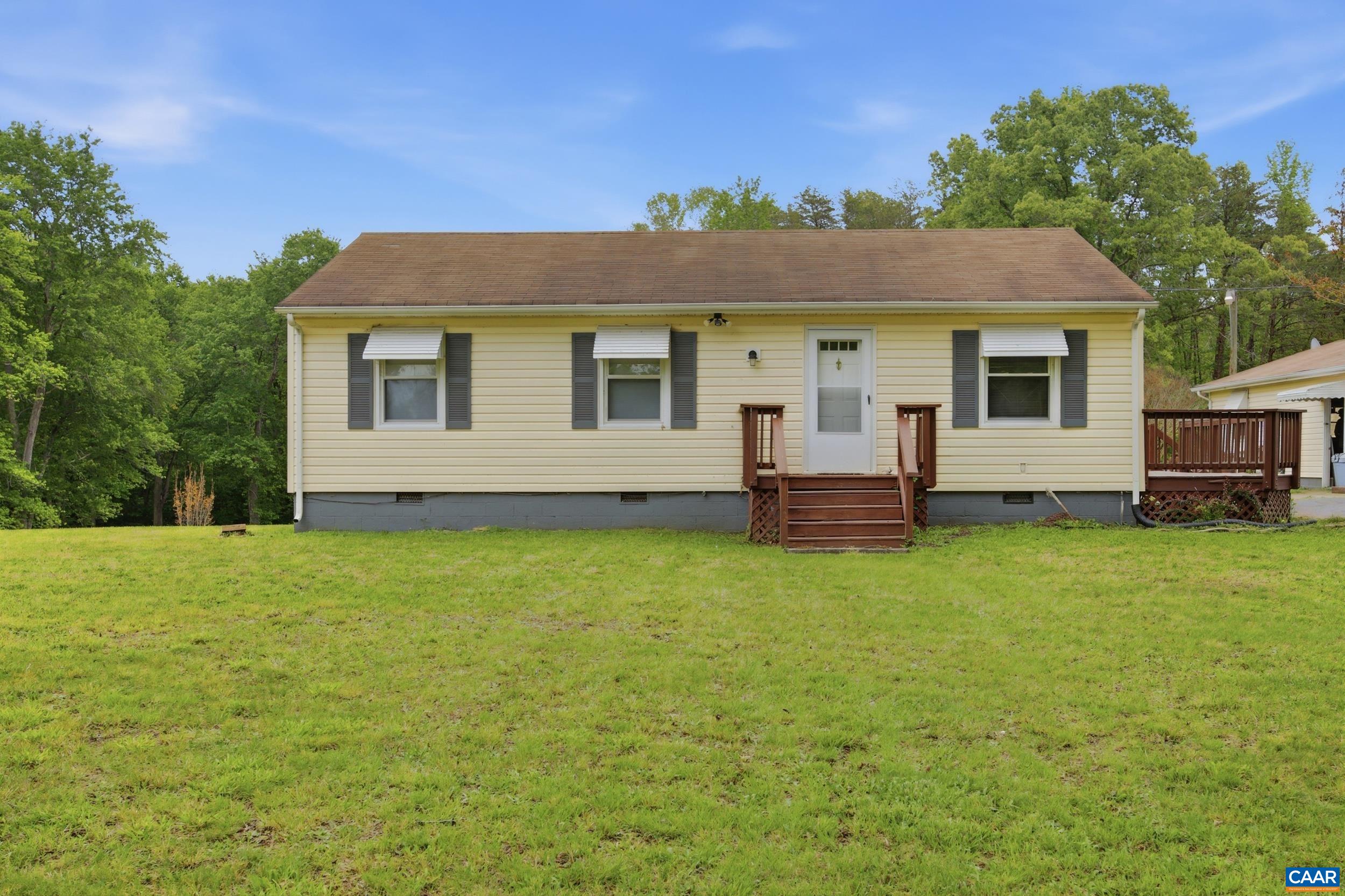 3590 Belle Meade Road Bumpass, VA 23024 - Photo 2 of 21 a front view of a house with a garden