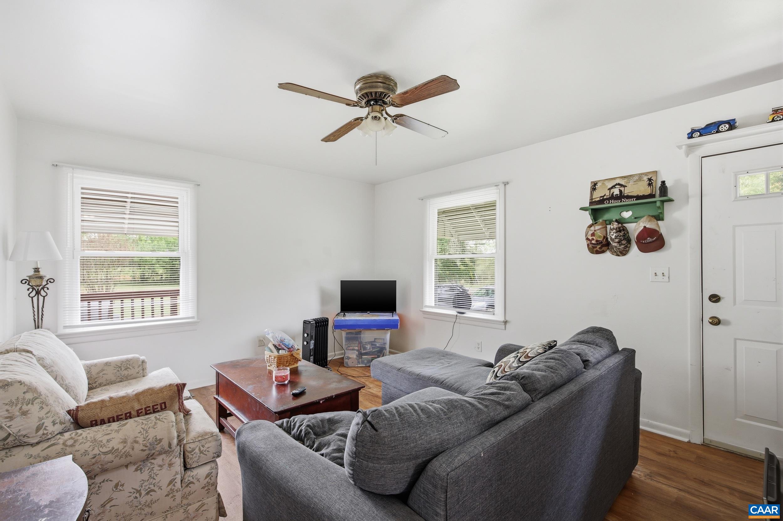 3590 Belle Meade Road Bumpass, VA 23024 - Photo 5 of 21 a living room with furniture and a flat screen tv