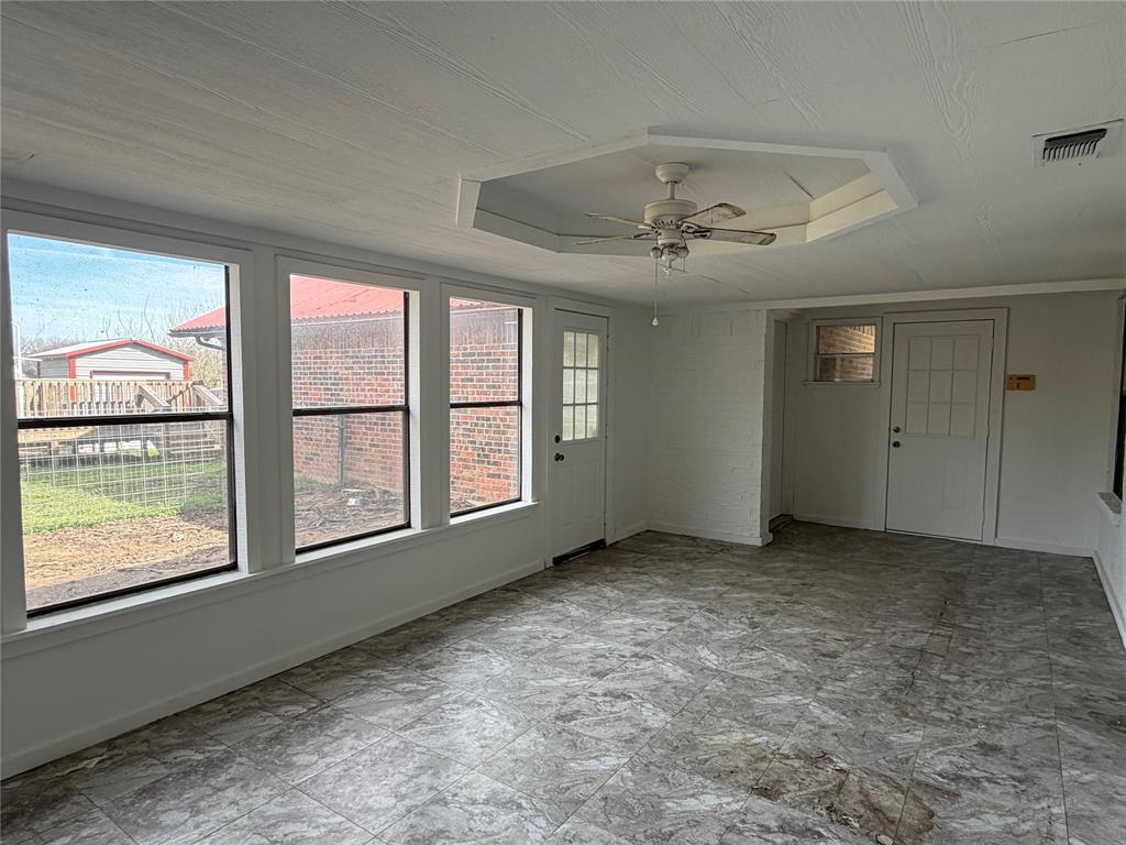 314 West 5th Street Springtown, TX 76082 - Photo 19 of 21 an empty room with windows and closet