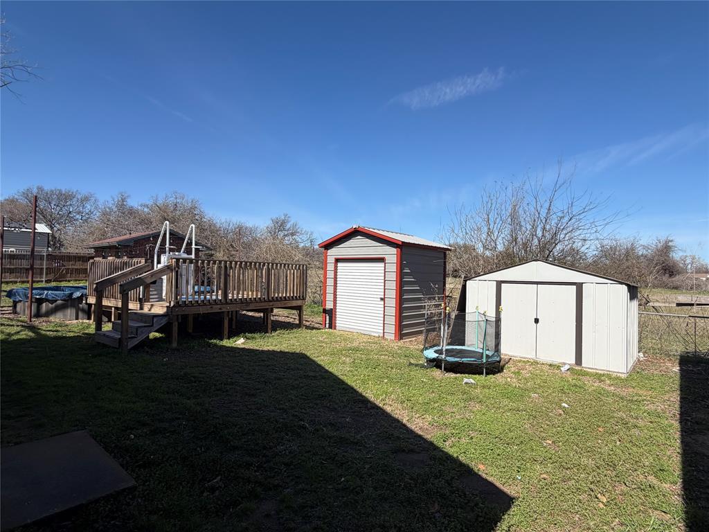 314 West 5th Street Springtown, TX 76082 - Photo 20 of 21 a front view of a house with a yard