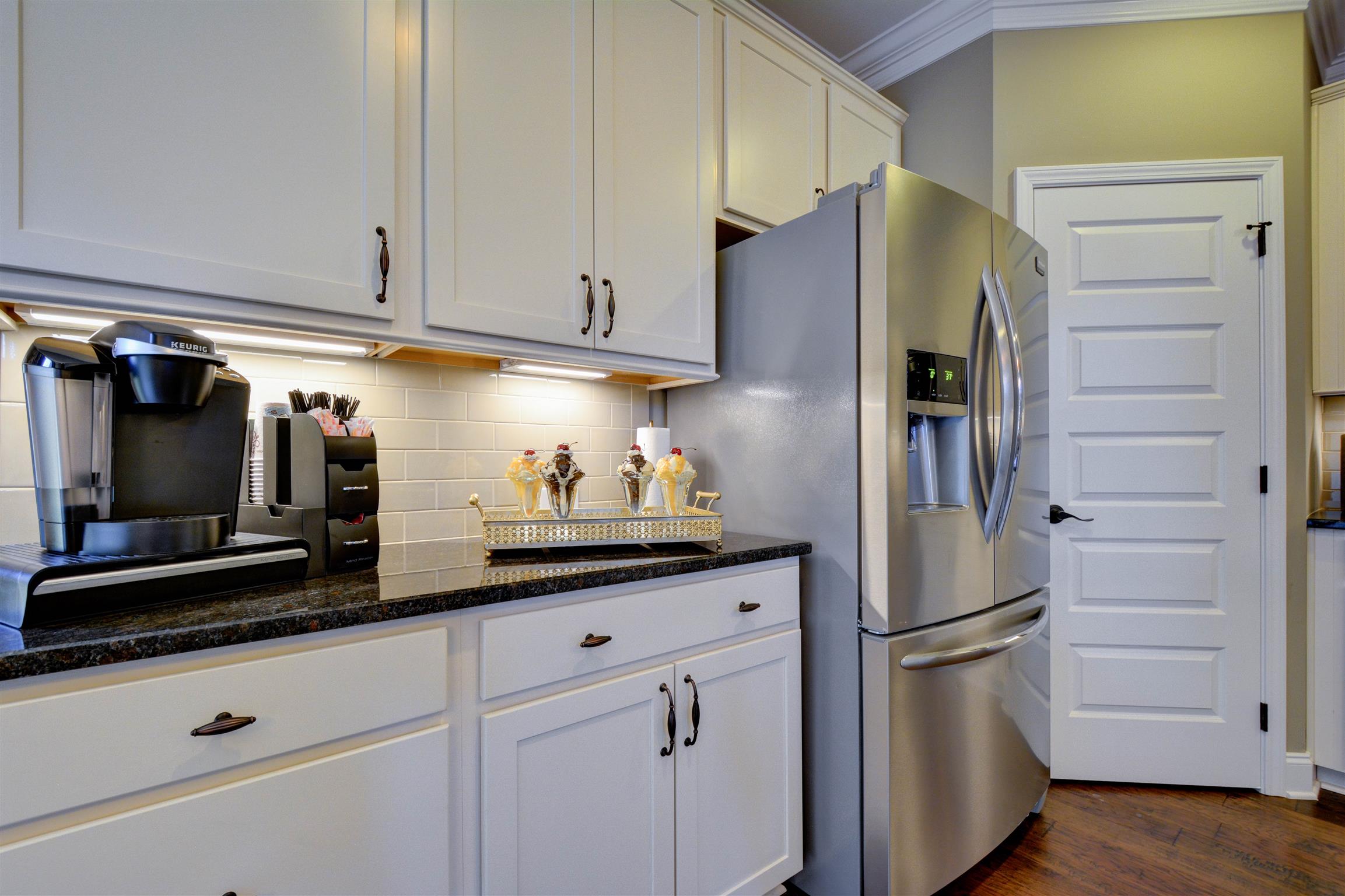 422 Quarry Road Gallatin, TN 37066 - Photo 13 of 29 The kitchen features an eat-on island and is combined with the dining area. *Photos are of a model home. Actual finishes may vary.*