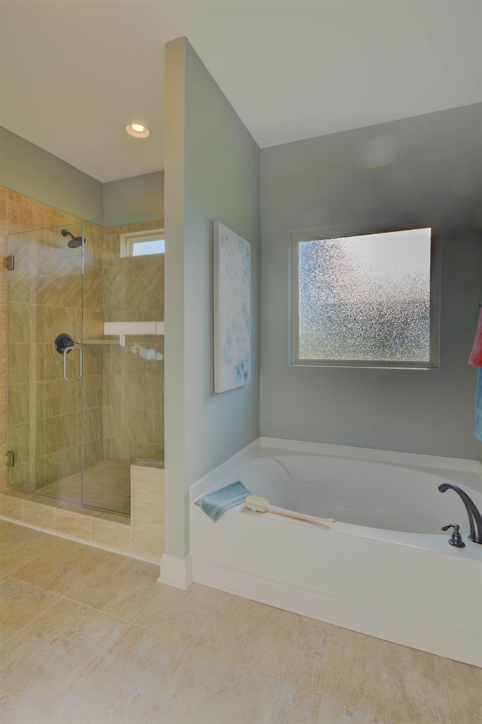 422 Quarry Road Gallatin, TN 37066 - Photo 18 of 29 The master suite is located on the main level and includes a large walk-in closet, double vanities, and separate tub and shower. *Photos are of a model home. Actual finishes may vary.*