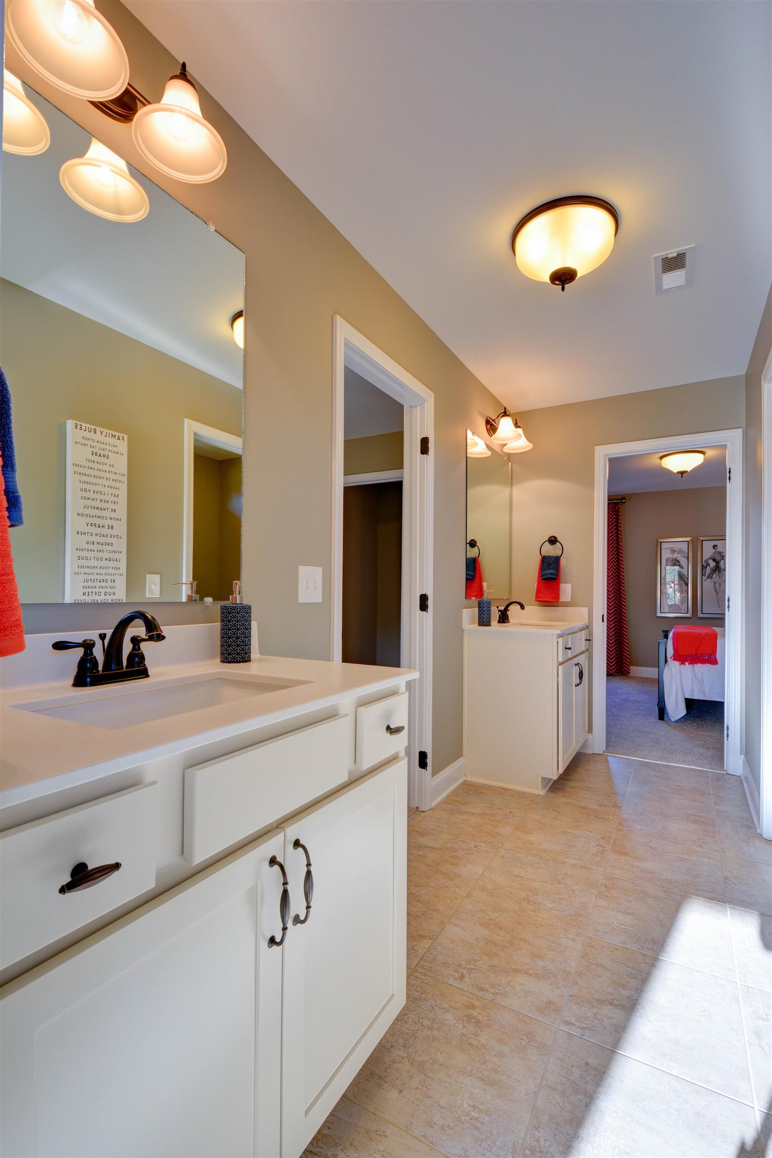 422 Quarry Road Gallatin, TN 37066 - Photo 20 of 29 The Jack & Jill bathroom upstairs connects bedrooms 3 & 4. *Photos are of a model home. Actual finishes may vary.*
