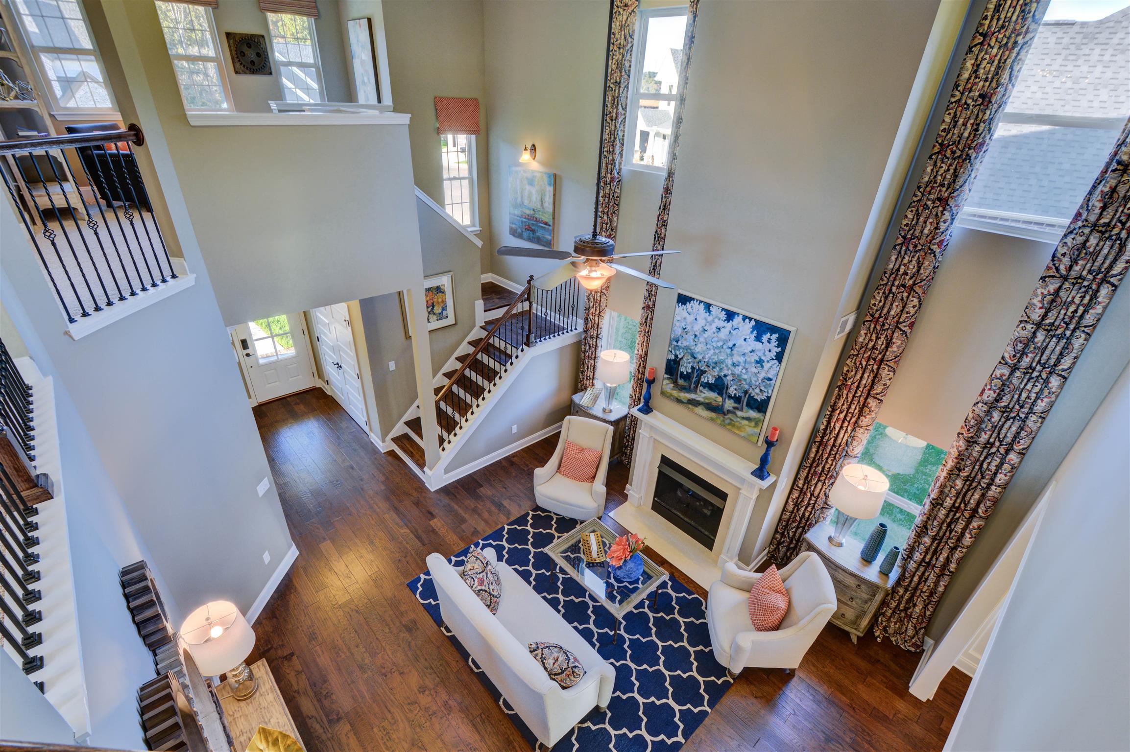 422 Quarry Road Gallatin, TN 37066 - Photo 5 of 29 The two-story great room with fireplace is very inviting and great for entertaining. *Photos are of a model home. Actual finishes may vary.*