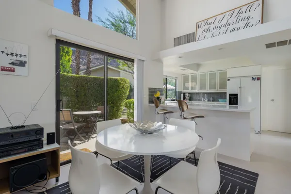 a kitchen with a table and chairs in it