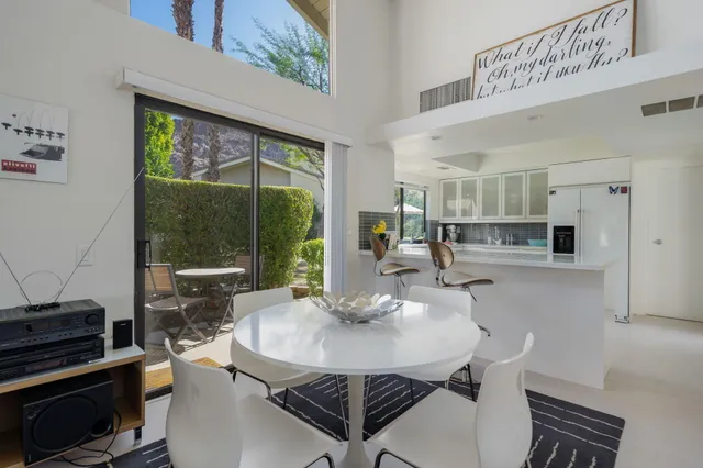 a kitchen with a table and chairs in it