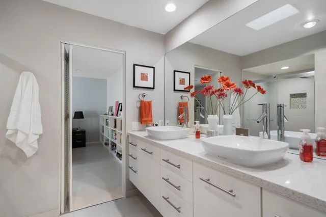 a bathroom with sink and mirror