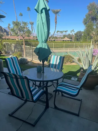 a view of a balcony with chairs