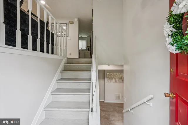 a view of staircase with white walls