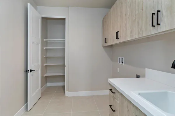 a bathroom with a sink and cabinets