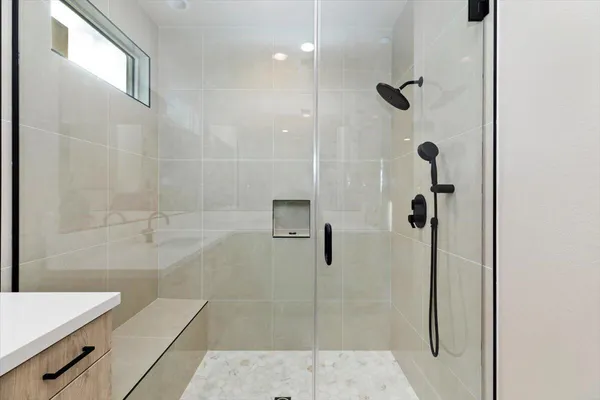 a bathroom with a shower and a toilet