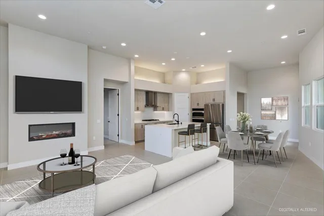 a living room with fireplace furniture and a flat screen tv