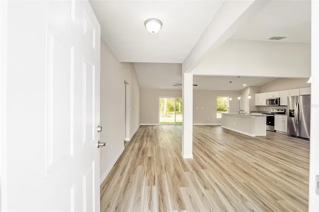 a view of a living room with wooden floor