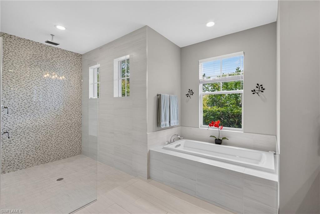 37 Johnnycake Drive Naples, FL 34110 - Photo 7 of 33 Dual vanity with dark wood-finish cabinetry, integrated sinks, and polished chrome fixtures